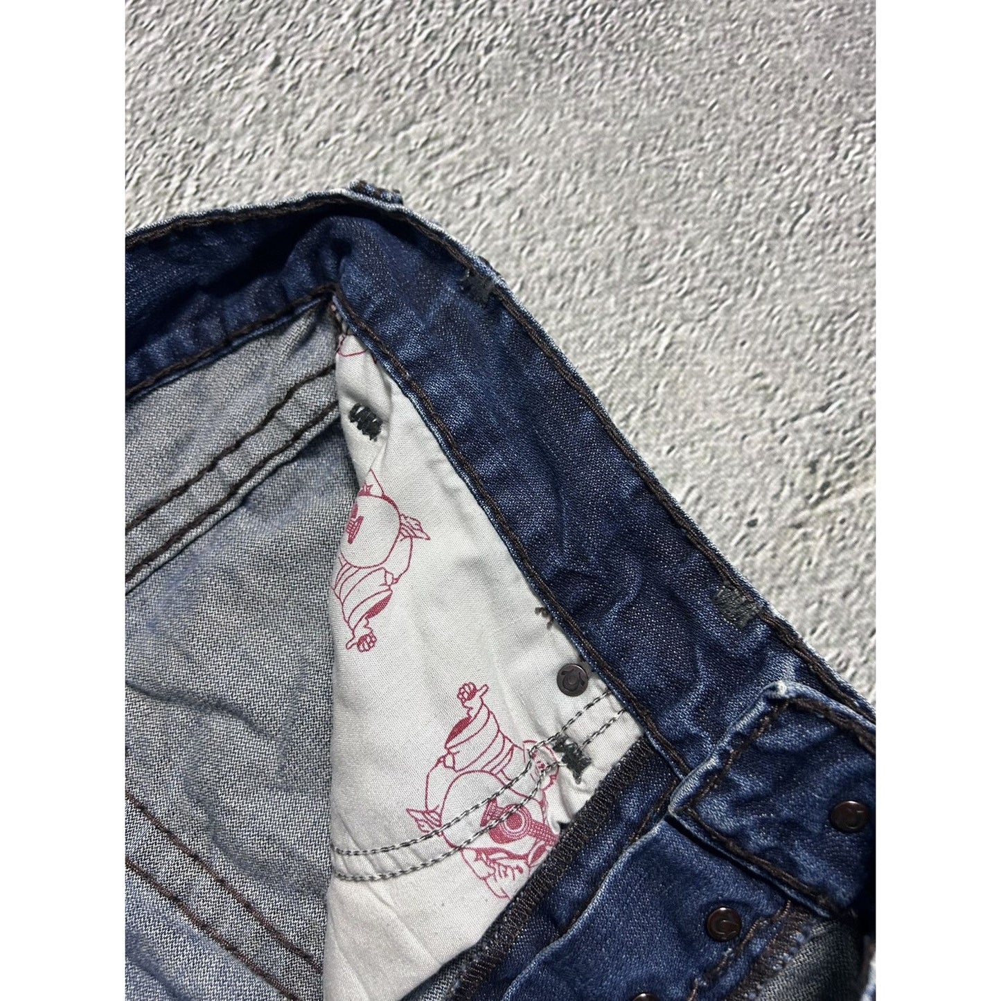 True Religion blue jeans white thick stitching Logan