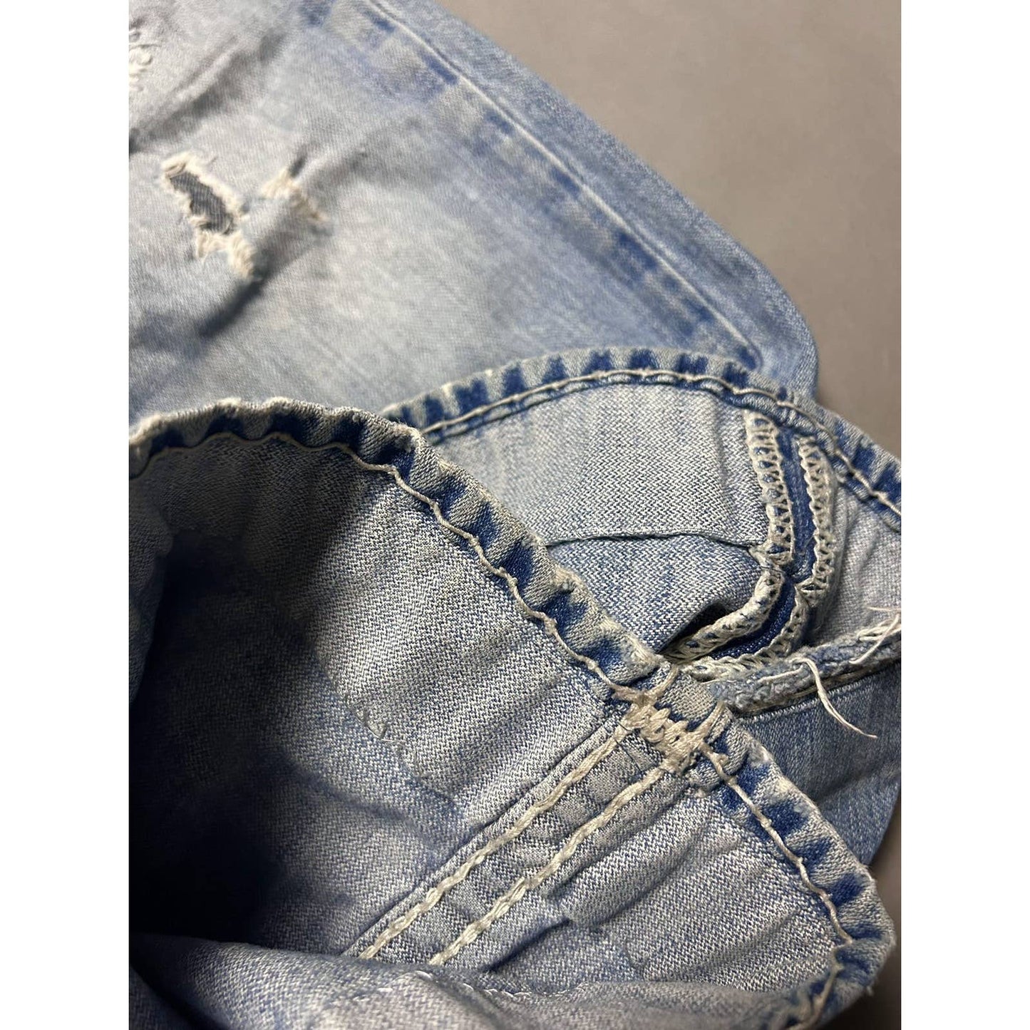 True Religion blue jeans white thick stitching distressed