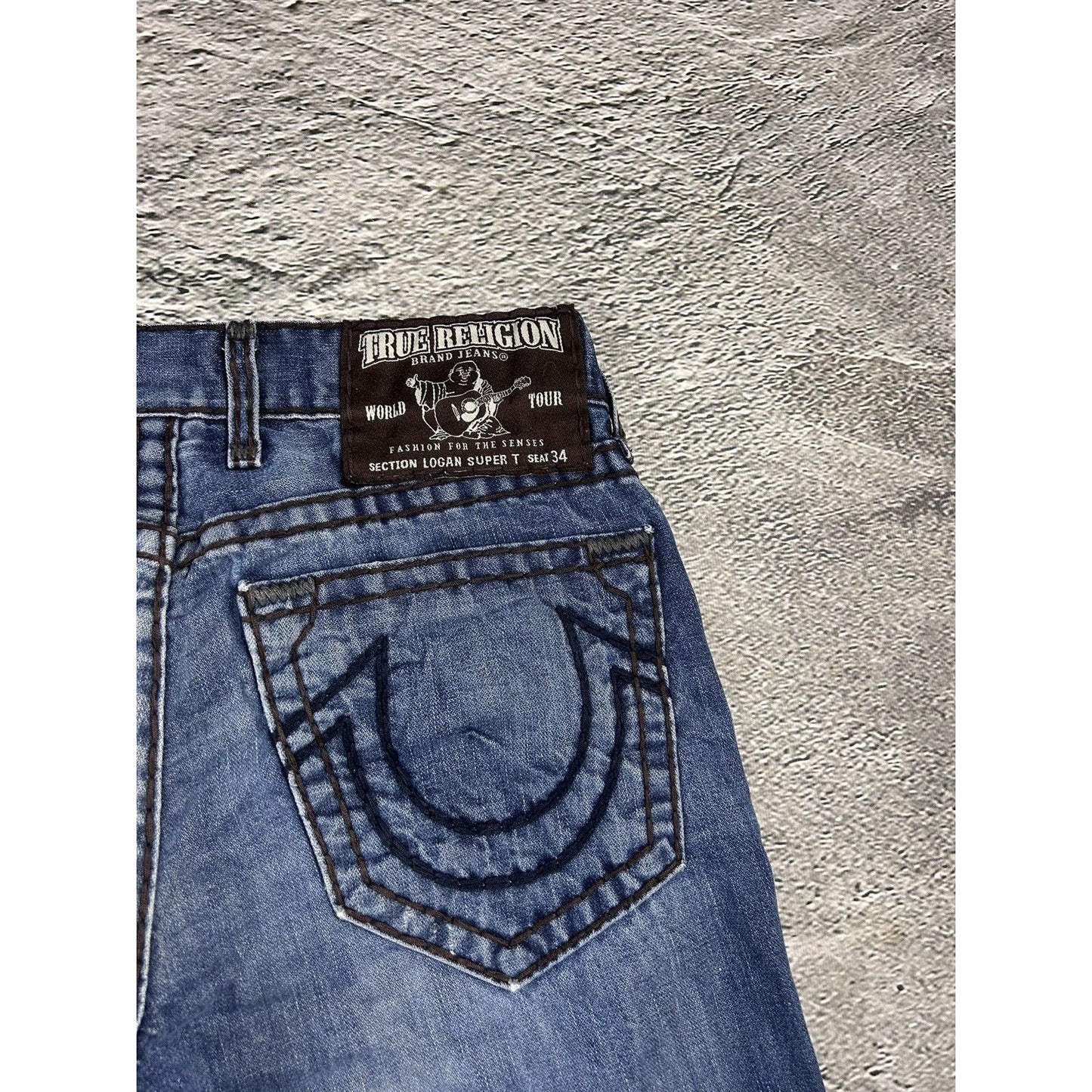 True Religion blue jeans white thick stitching Logan