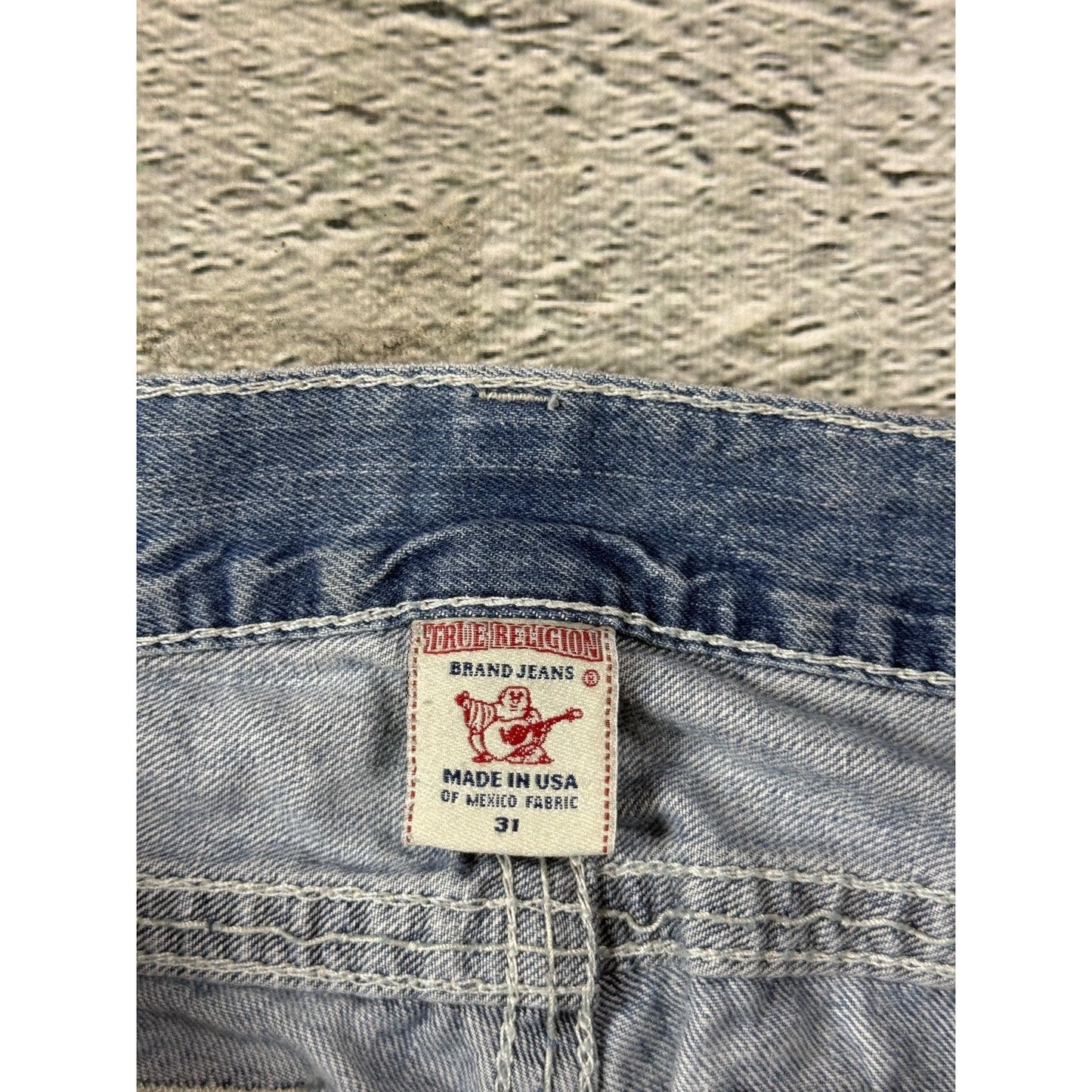 True Religion washed light blue jeans white stitching Bobby