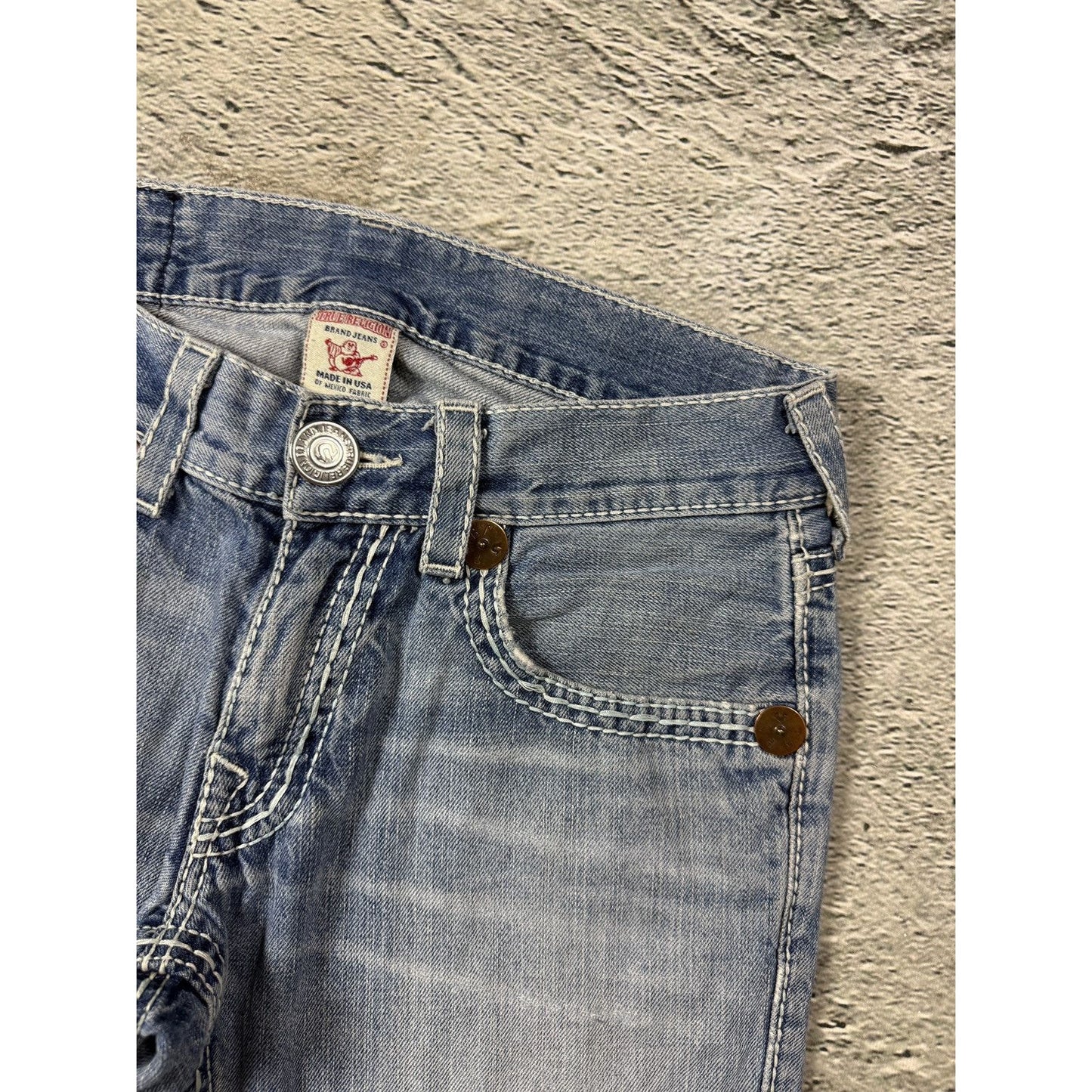 True Religion washed light blue jeans white stitching Bobby