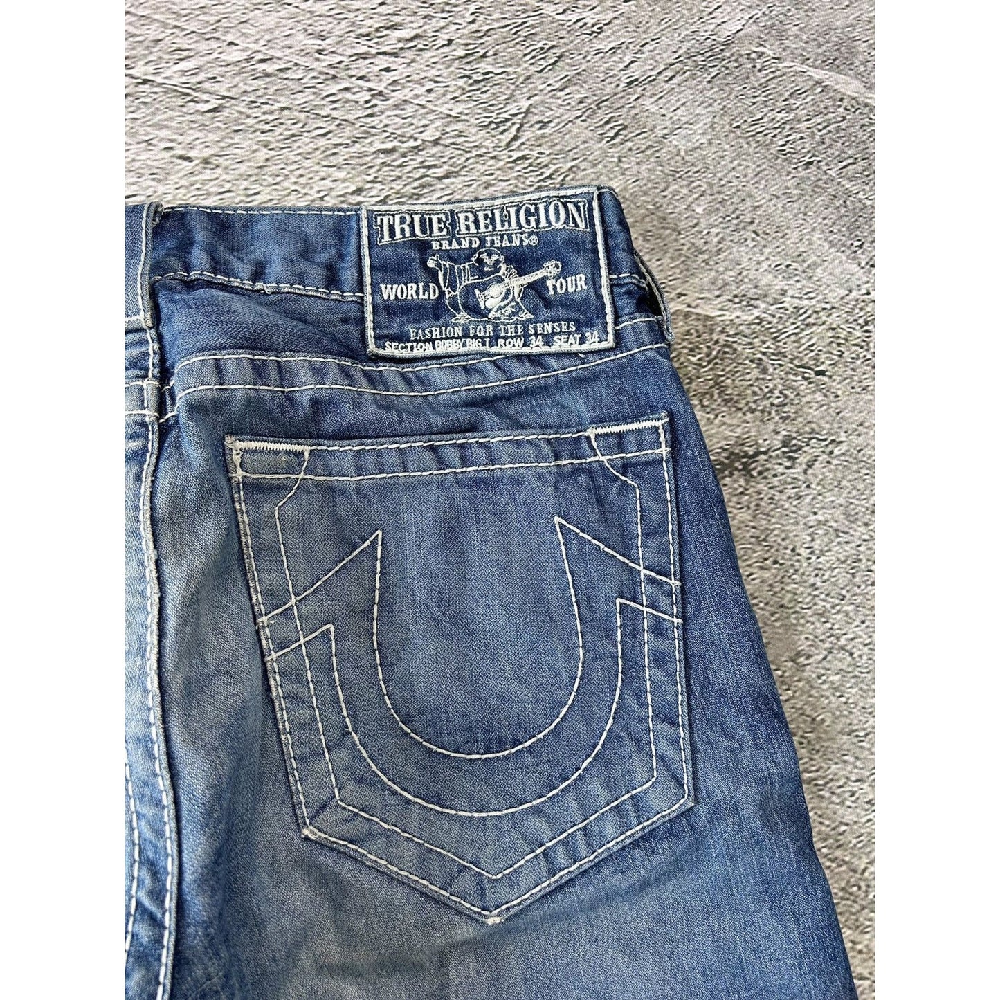 True Religion blue jeans white thick stitching Bobby