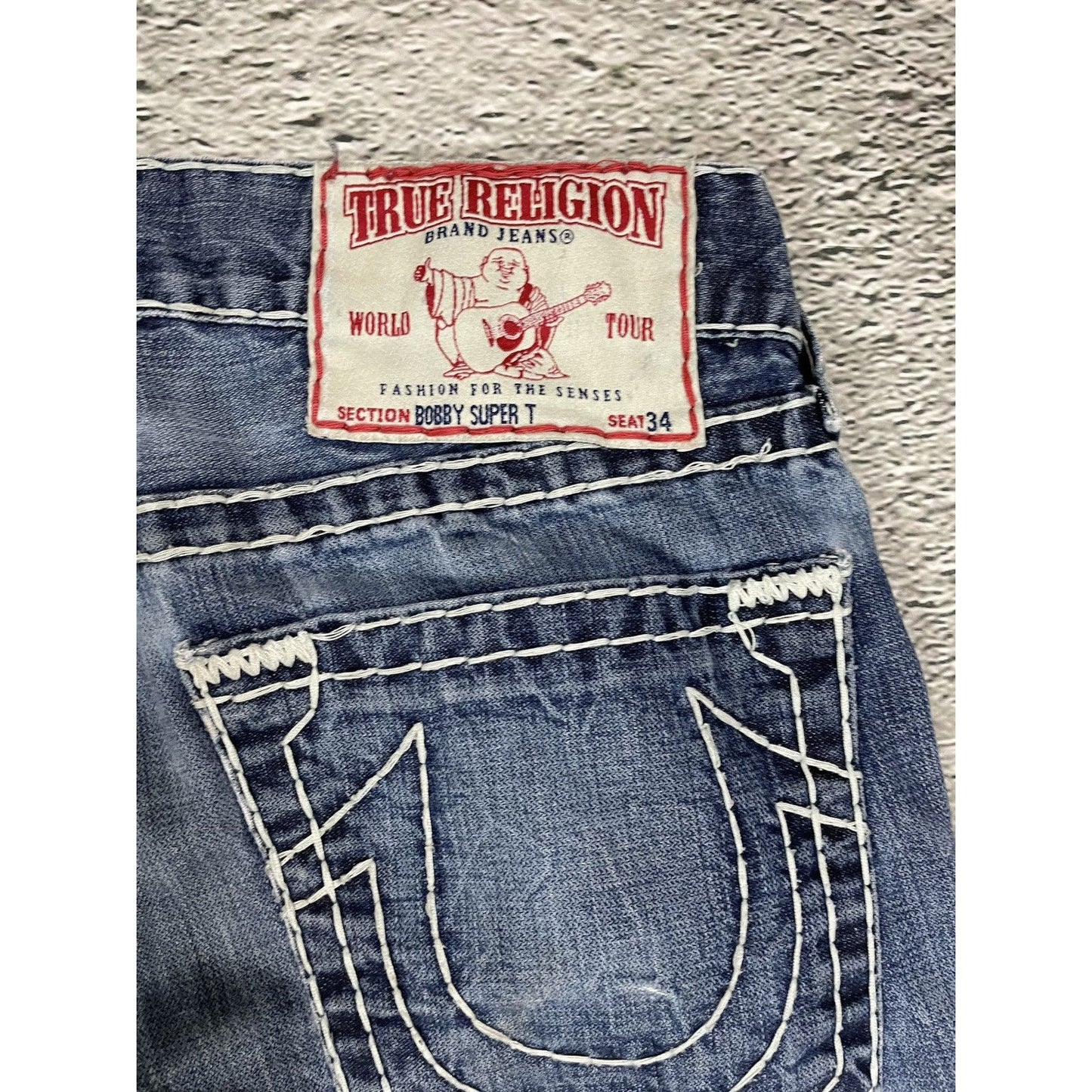 True Religion blue jeans white thick stitching Bobby
