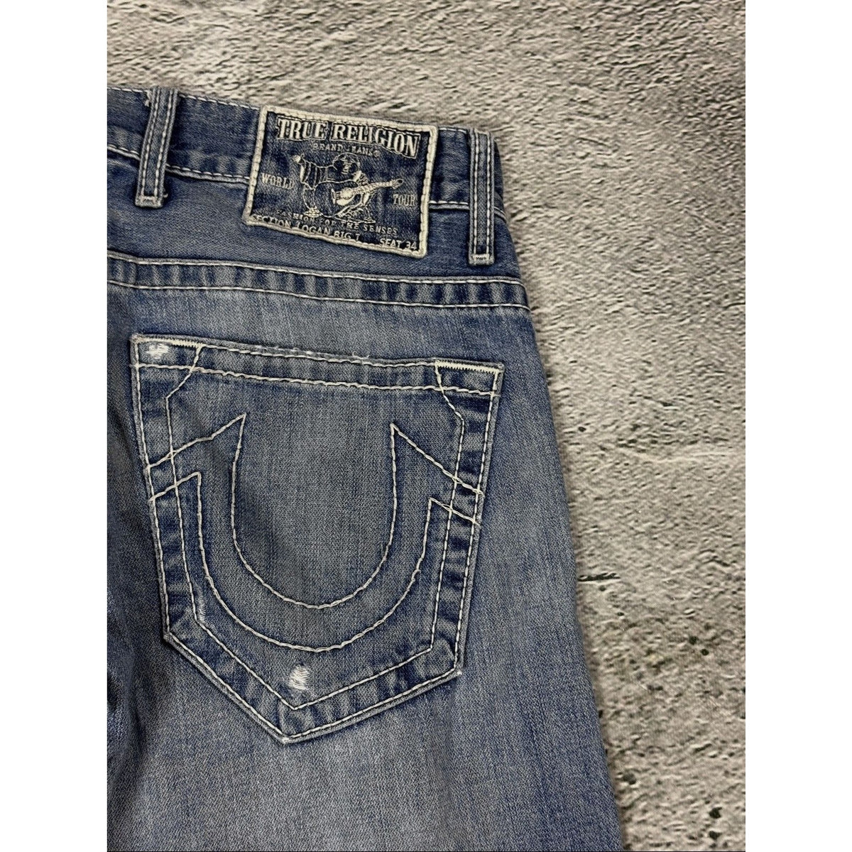 True Religion blue washed jeans white thick stitching Logan