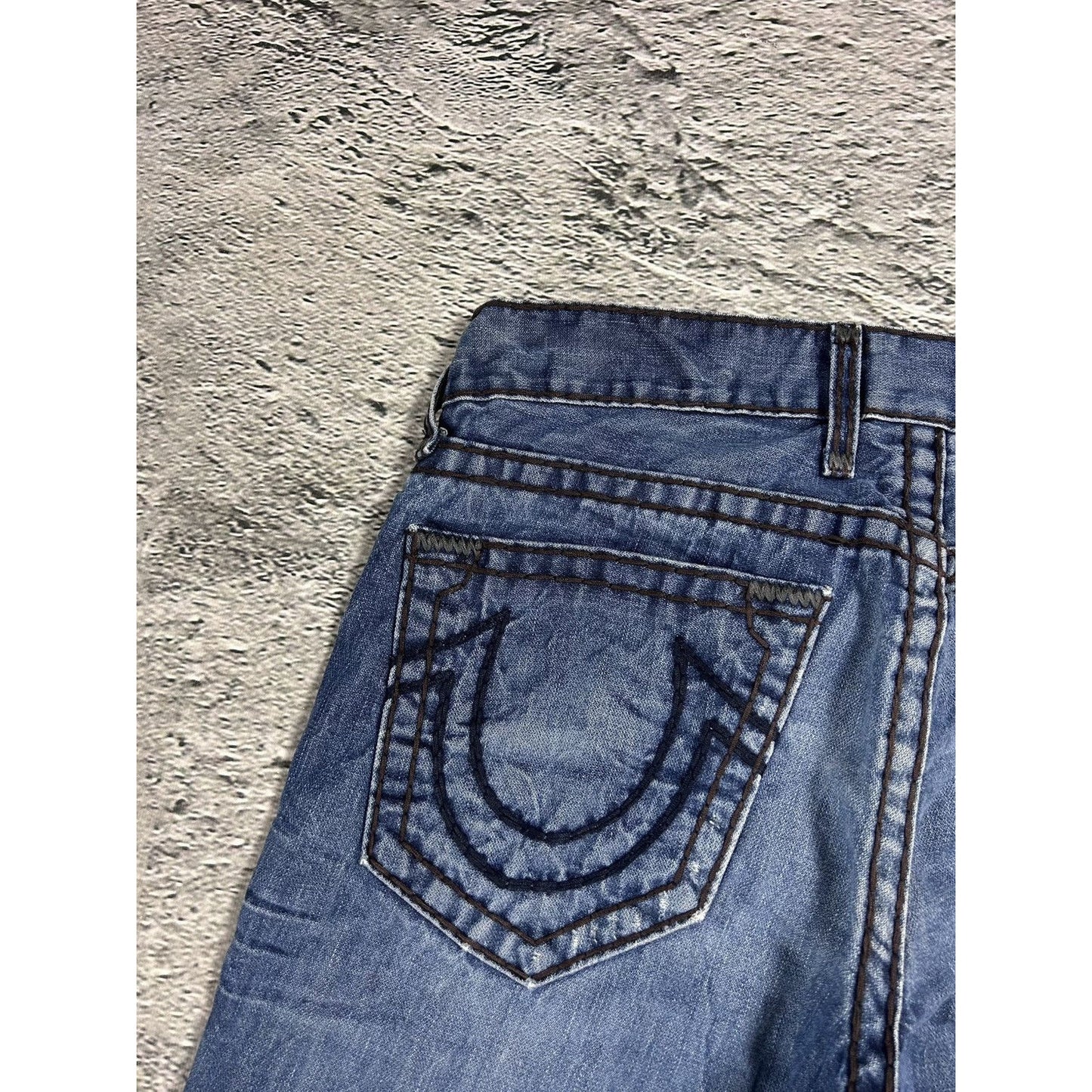 True Religion blue jeans white thick stitching Logan