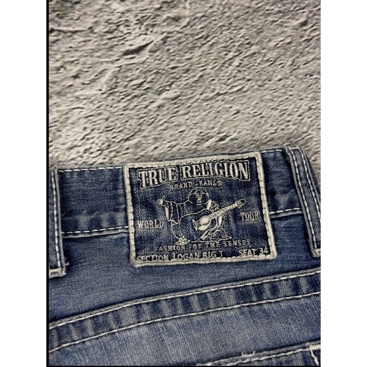 True Religion blue washed jeans white thick stitching Logan