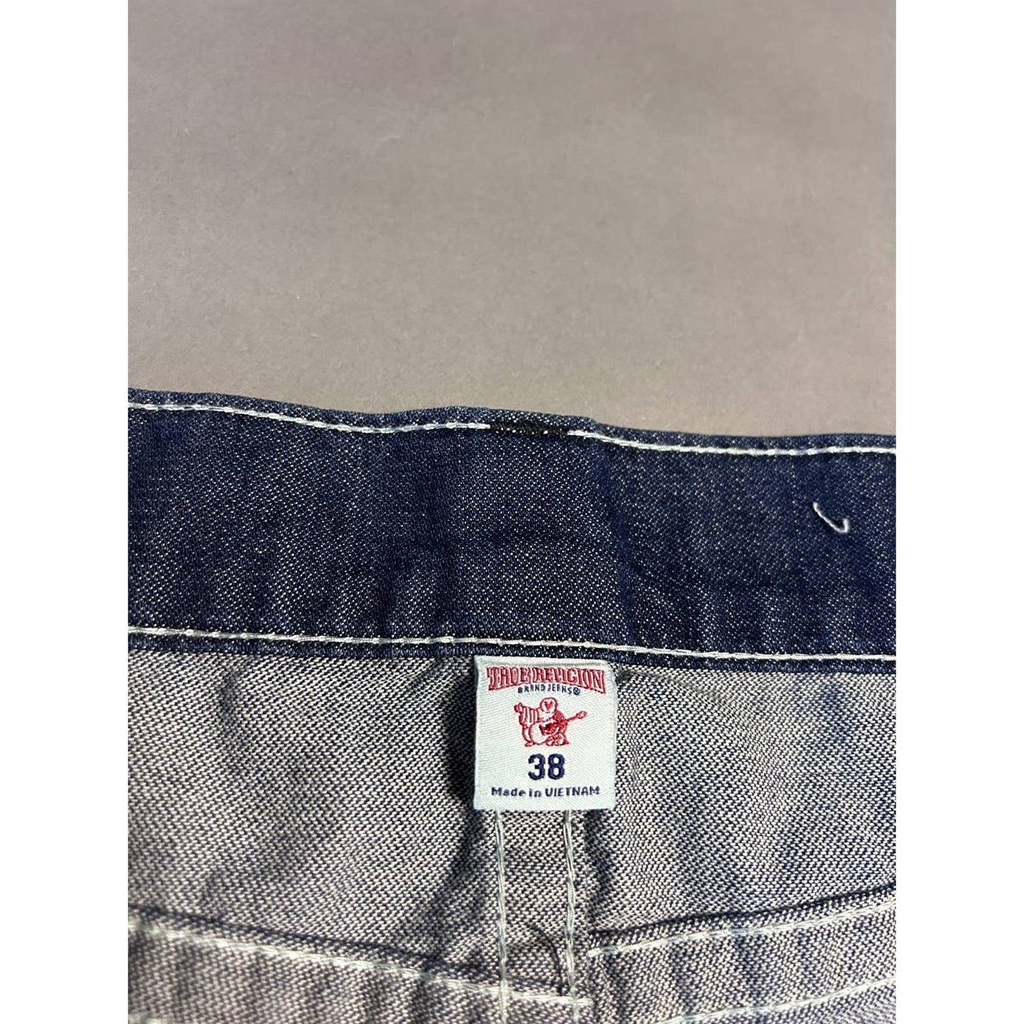 True Religion vintage navy jeans distressed black stitching