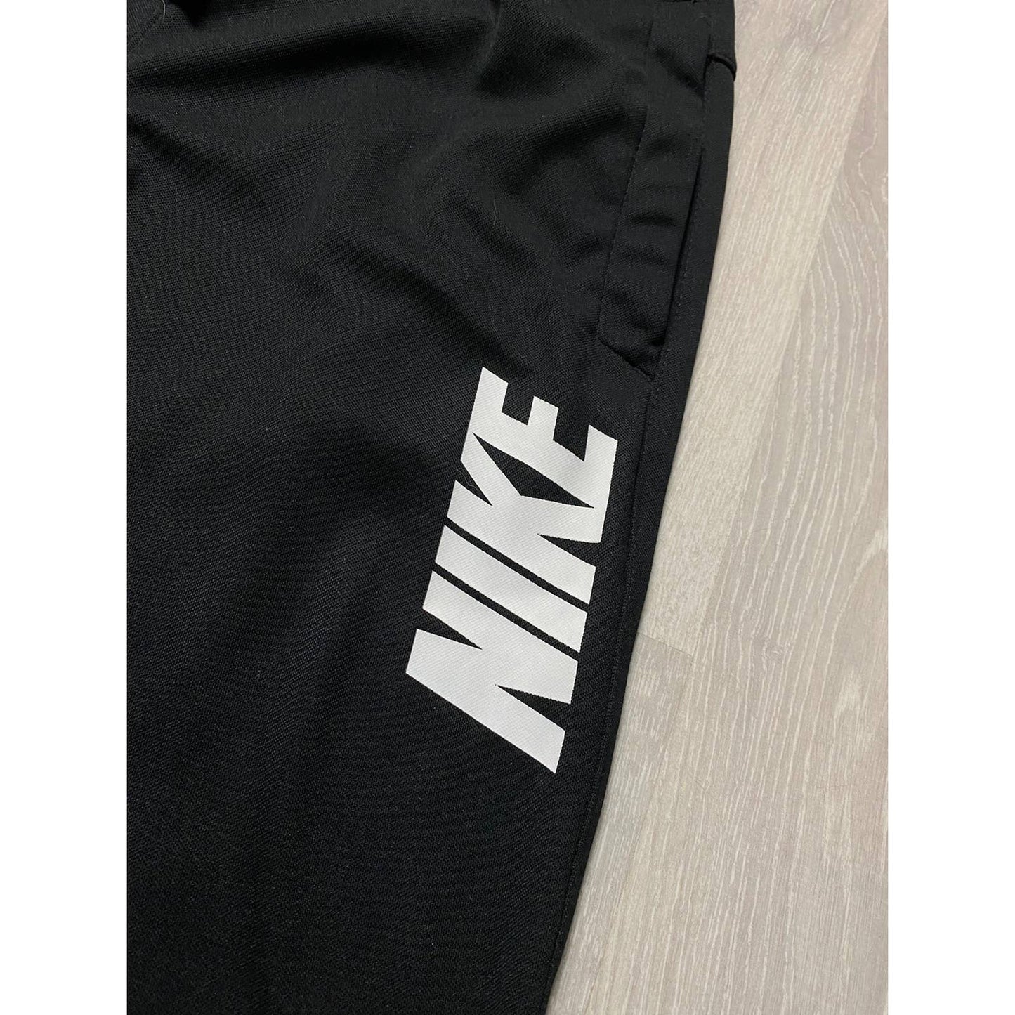 Nike vintage black sweatpants spell out big logo